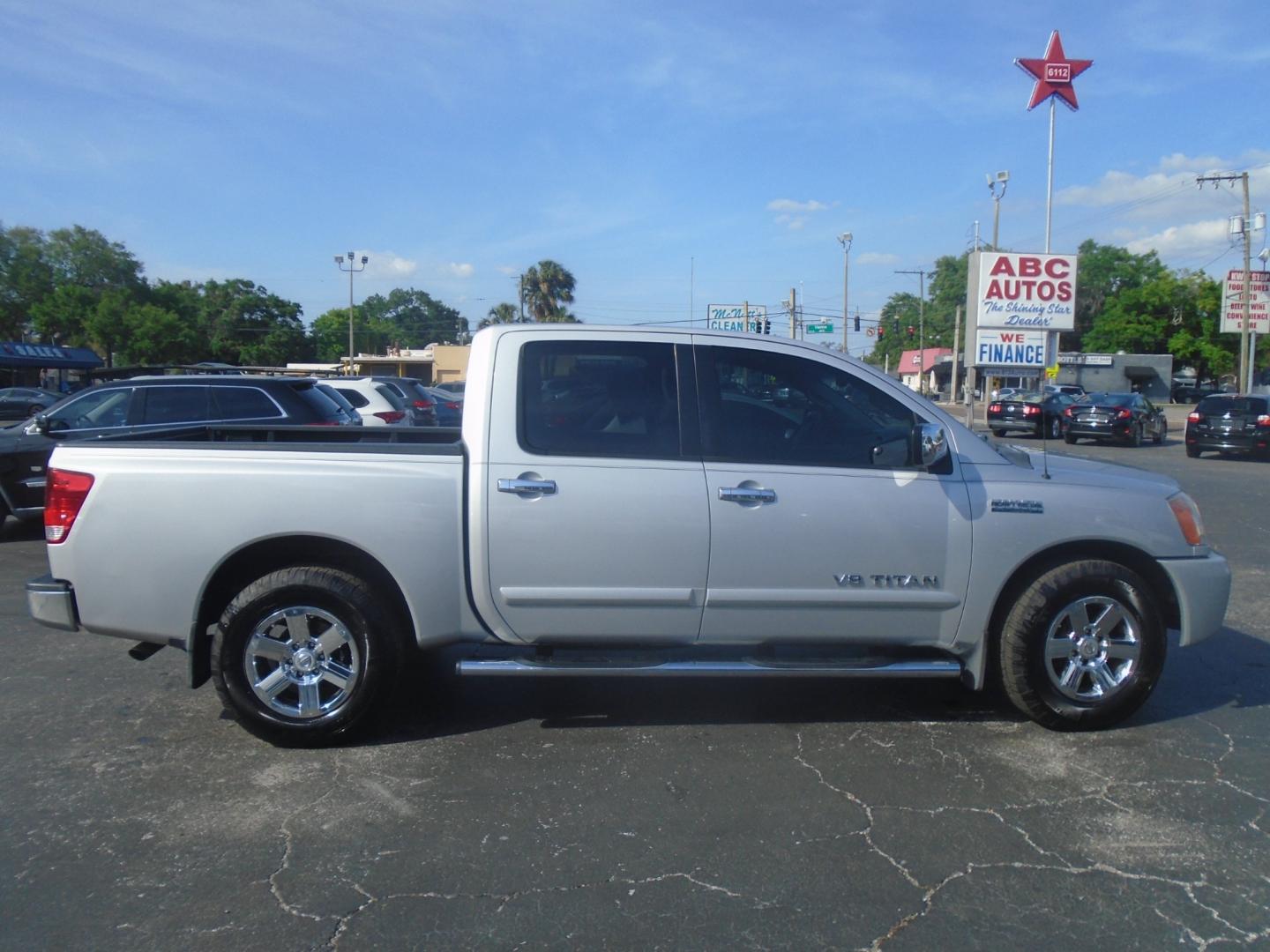 2012 Silver /Grey Nissan Titan SV Crew Cab 2WD (1N6BA0ED4CN) with an 5.6L V8 DOHC 32V FFV engine, 5-Speed Automatic transmission, located at 6112 N Florida Avenue, Tampa, FL, 33604, (888) 521-5131, 27.954929, -82.459534 - Photo#2